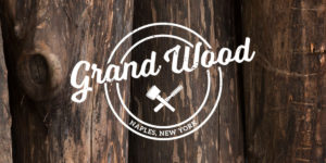 grand wood logo on top of wooden slats